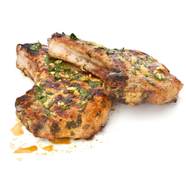 Cooked pork chops with seasoning on a white background